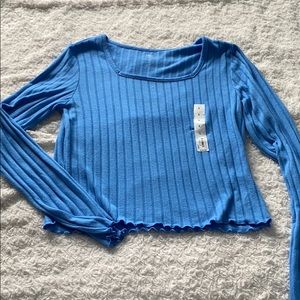 Bright blue cropped long sleeve shirt